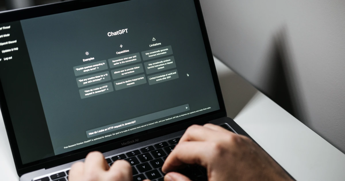 Person using ChatGPT on a laptop